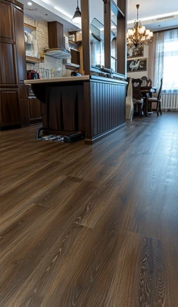 Refinished hardwood floor in an open-plan kitchen and living area