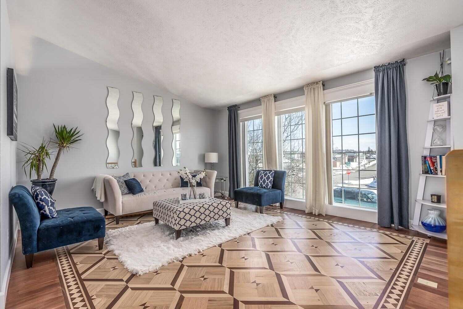 Living room with a custom patterned hardwood floor and decorative border