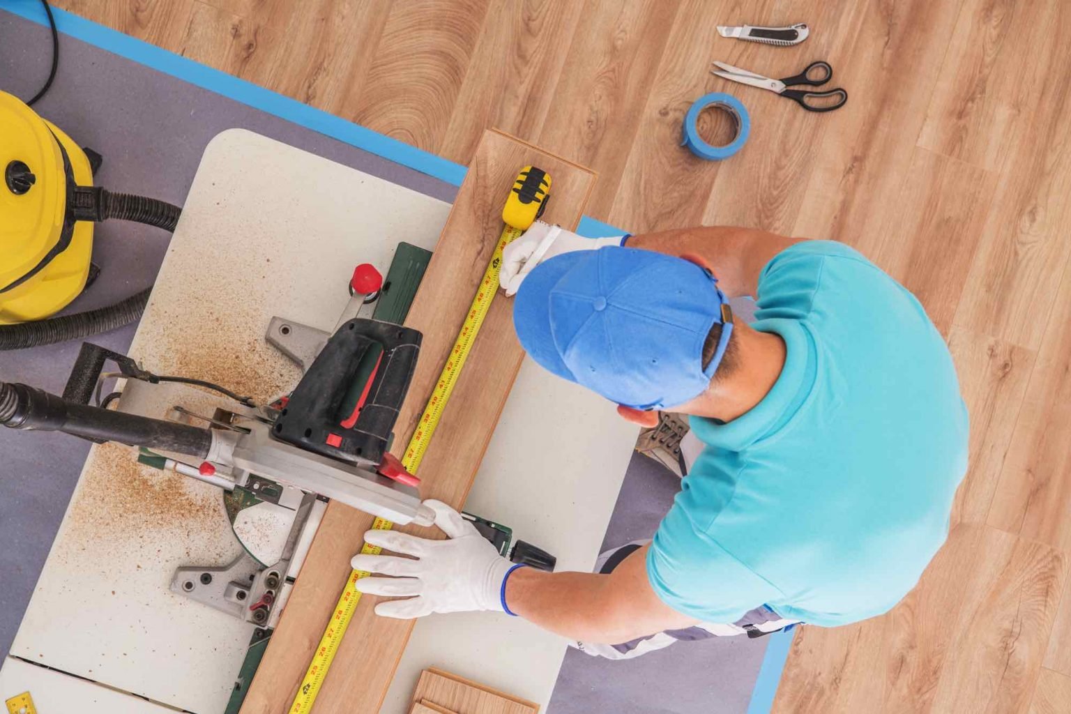 Flooring contractor installing wood planks