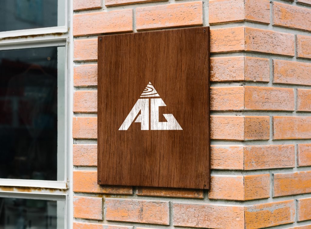 AG Floor Covering wooden sign mounted on a brick wall